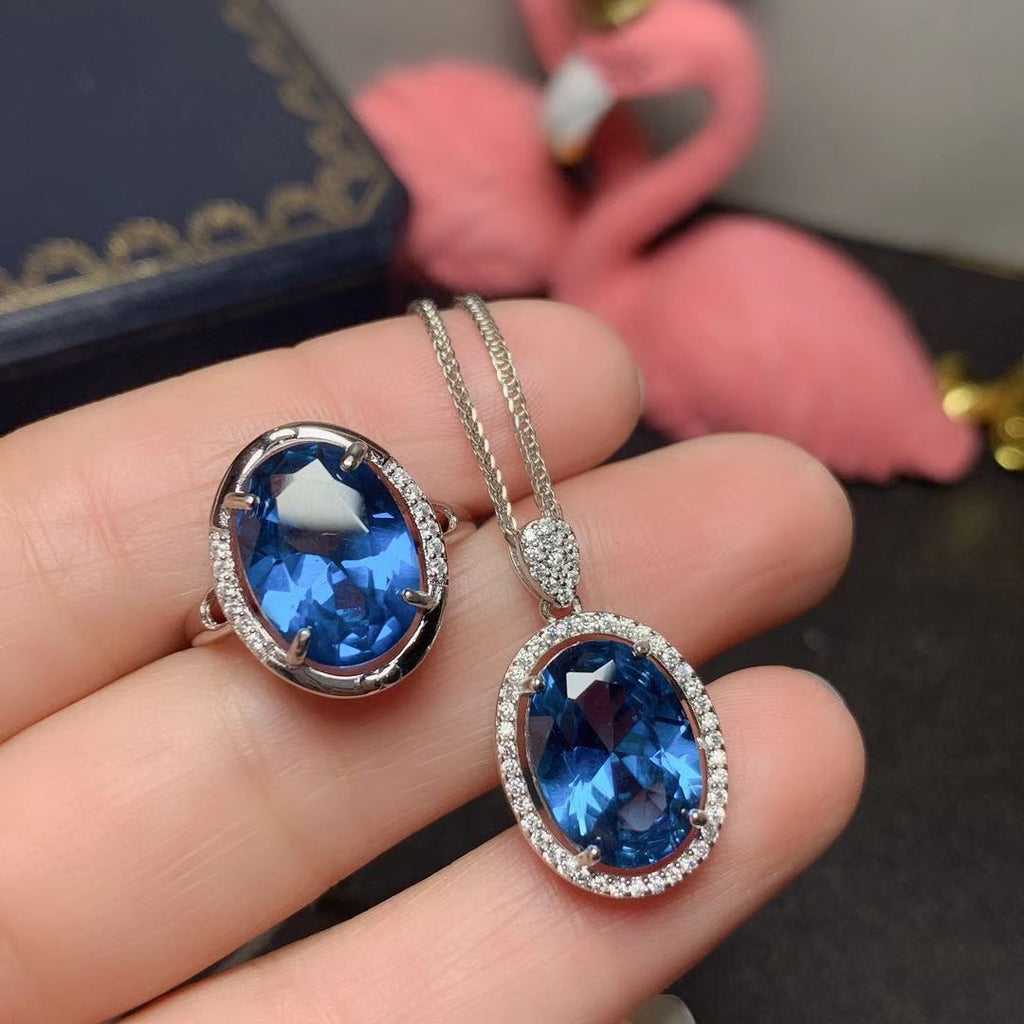 Juego de anillos y colgante de topacio azul de Londres con incrustaciones de plata 925. Se entrega un juego.