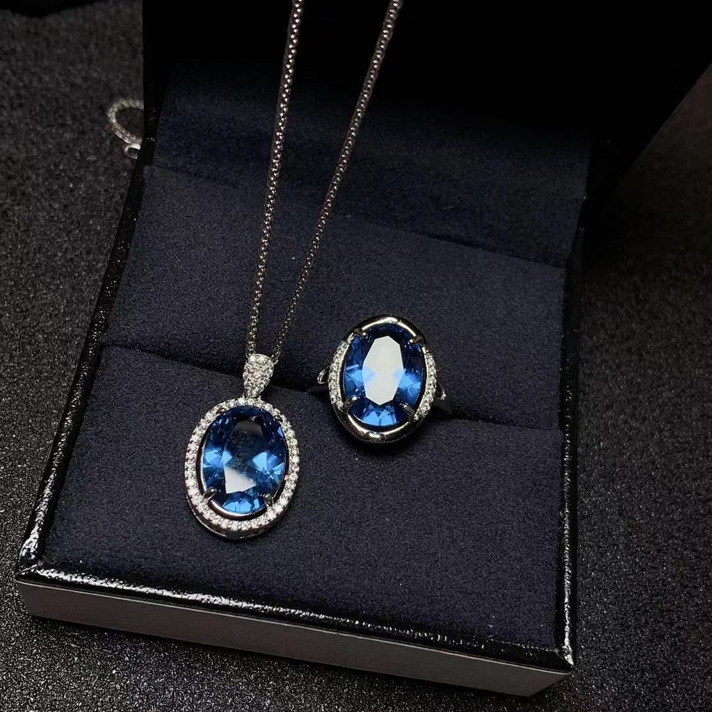 Juego de anillos y colgante de topacio azul de Londres con incrustaciones de plata 925. Se entrega un juego.
