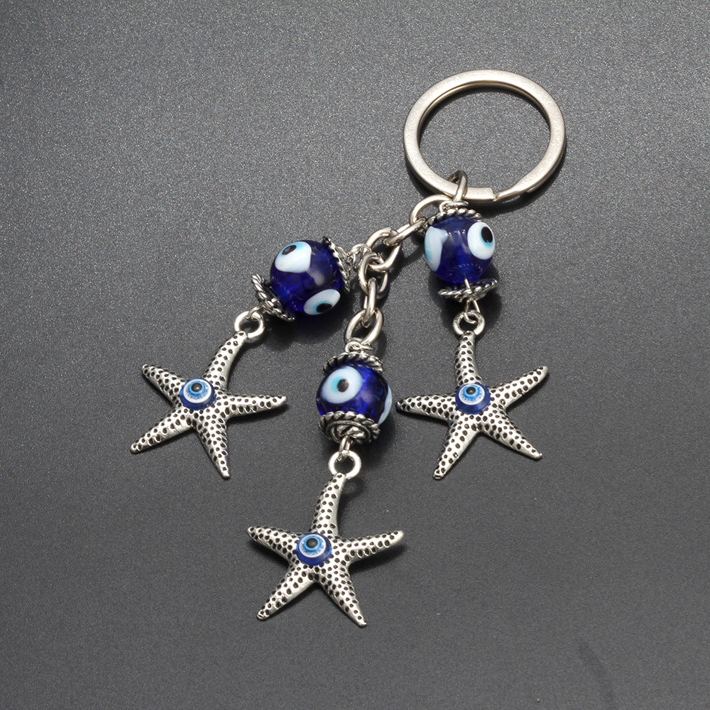 Llavero de estrella de mar, pavo, ojo azul