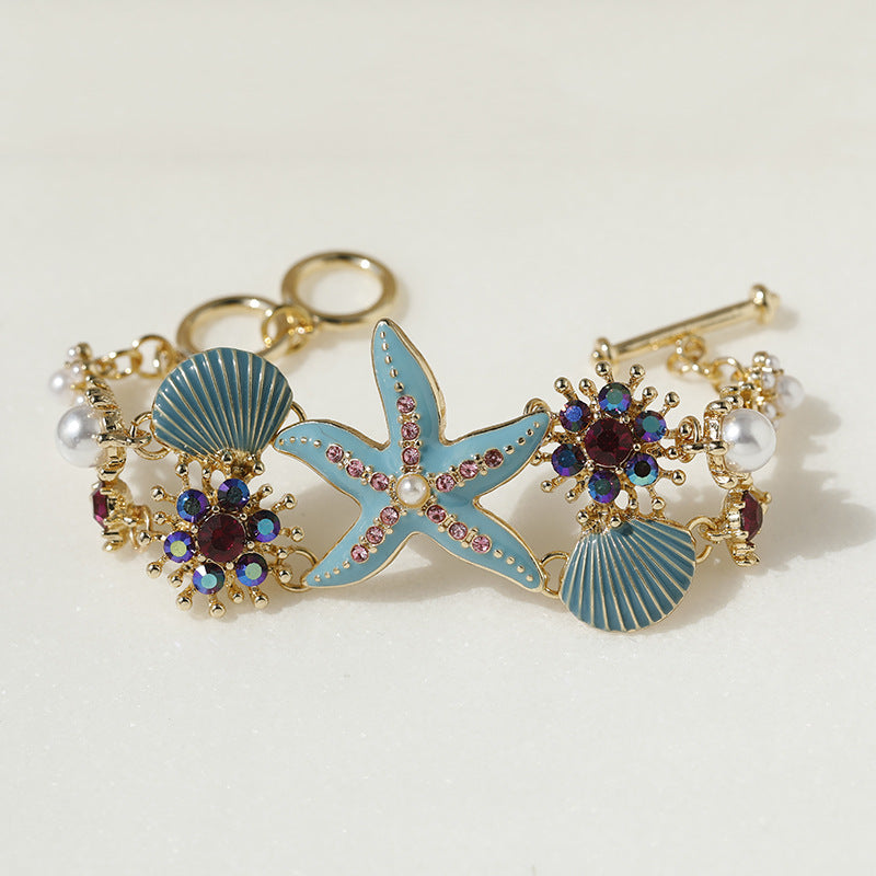 Pulsera de niña con diseño de estrellas de mar, concha y diamantes de imitación