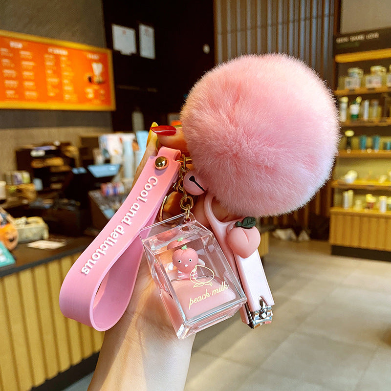 Bolsa de leche de durazno de cristal con botella de leche, llavero, colgante de bola de pelo.