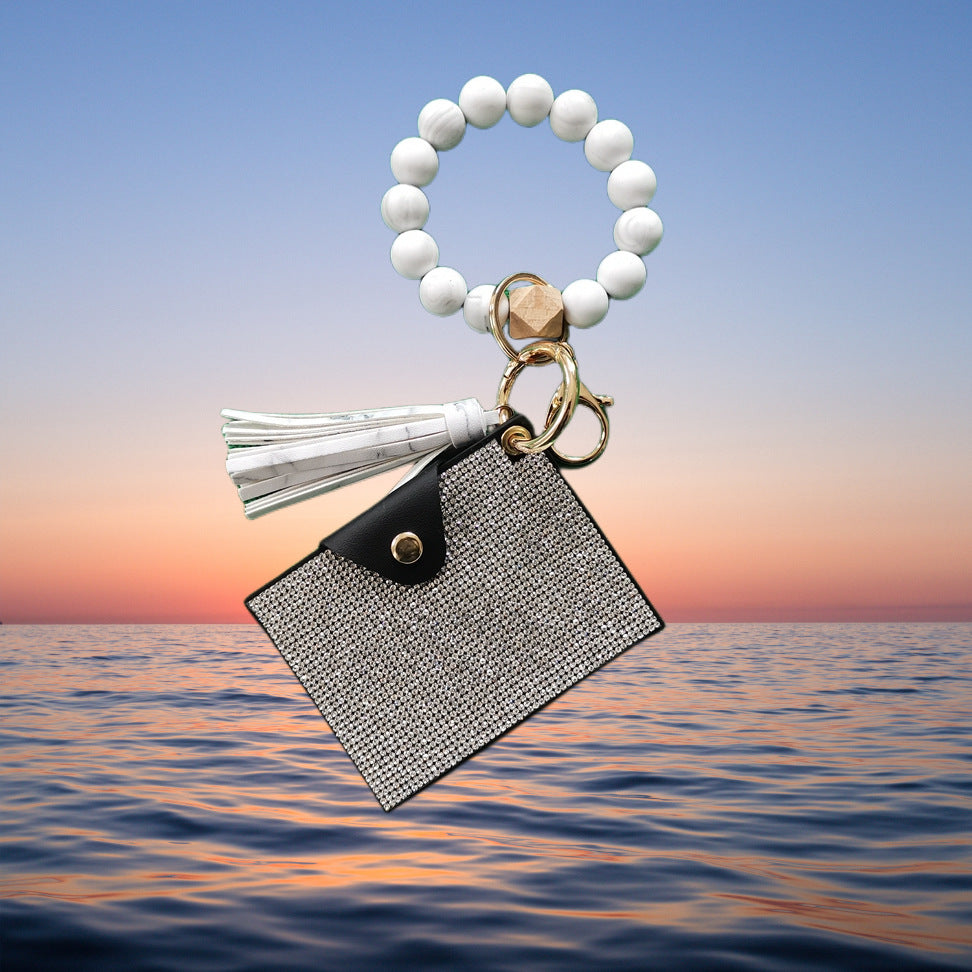 Pulsera de cuentas de silicona con borla y letra, y bolsa de diamantes de imitación
