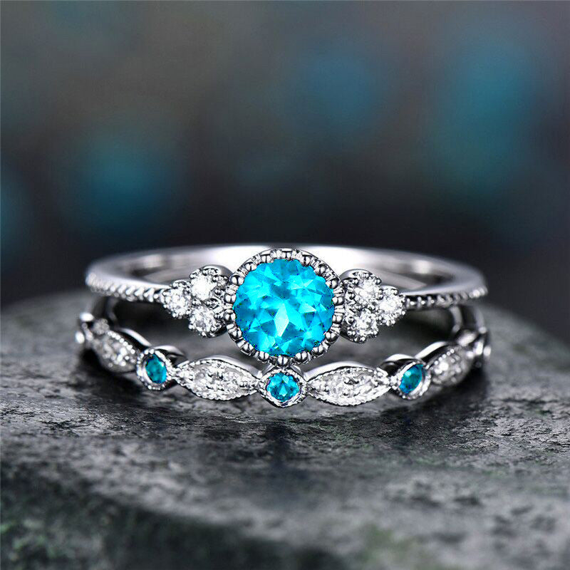 2 anillos de diamantes de colores con pedrería