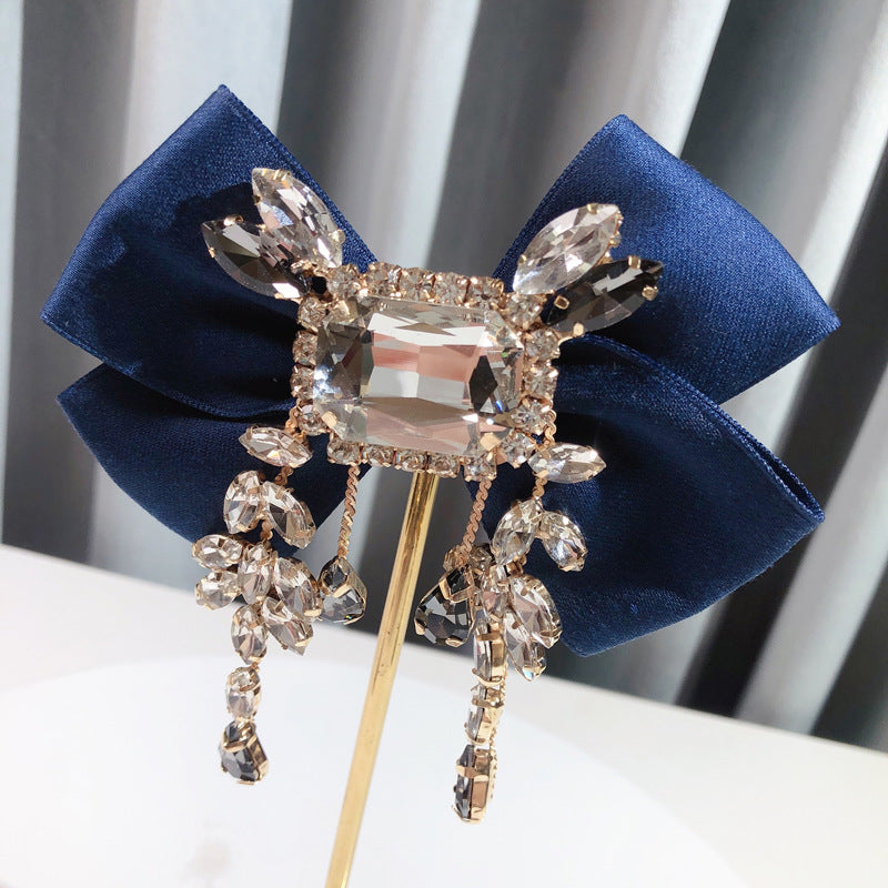 Broche de lazo británico vintage sólido de diamantes de imitación