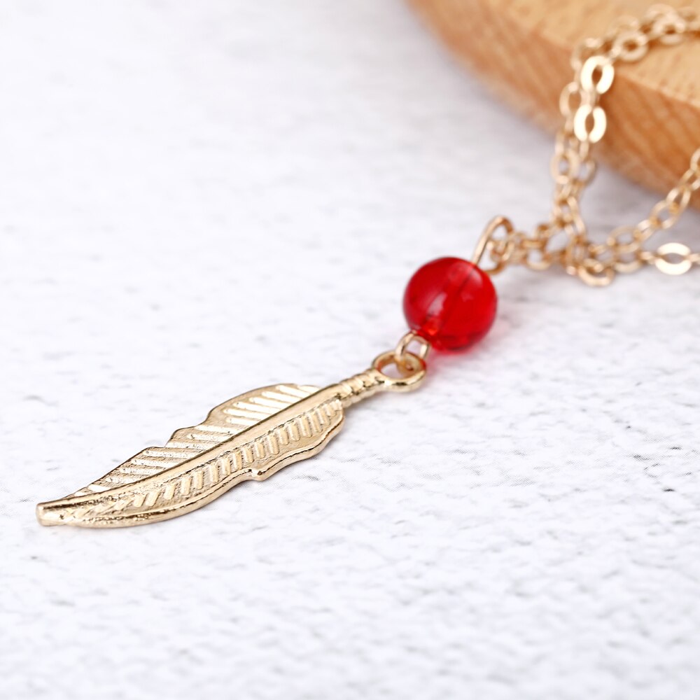 Tobillera de plumas con cuentas de cristal