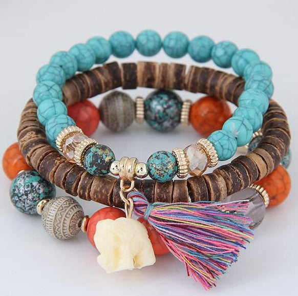 Brazalete de elefante bebé con borlas de cuentas de madera y varias capas