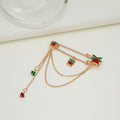 Broche de moda con cadena y cascabel
