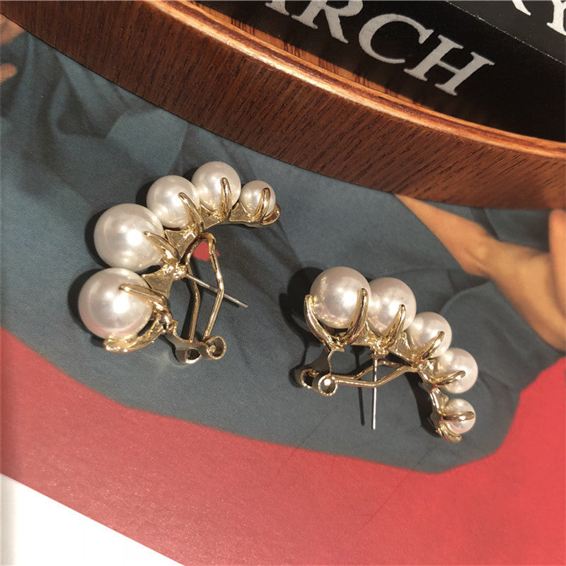 Pendientes con broche de Michel Lobe Wrap