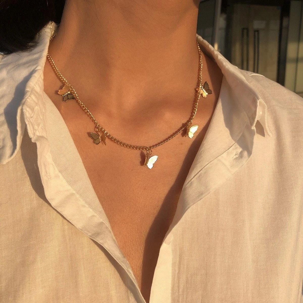 Collar con colgante de mariposa