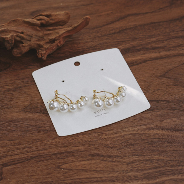 Pendientes con broche de Michel Lobe Wrap