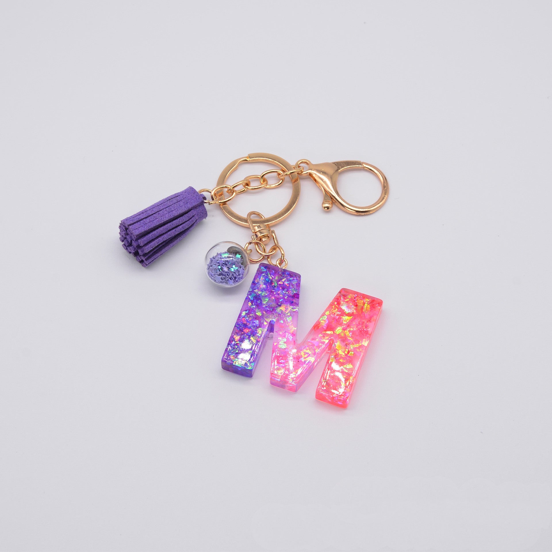 Llavero de resina epoxi morada con letras en inglés