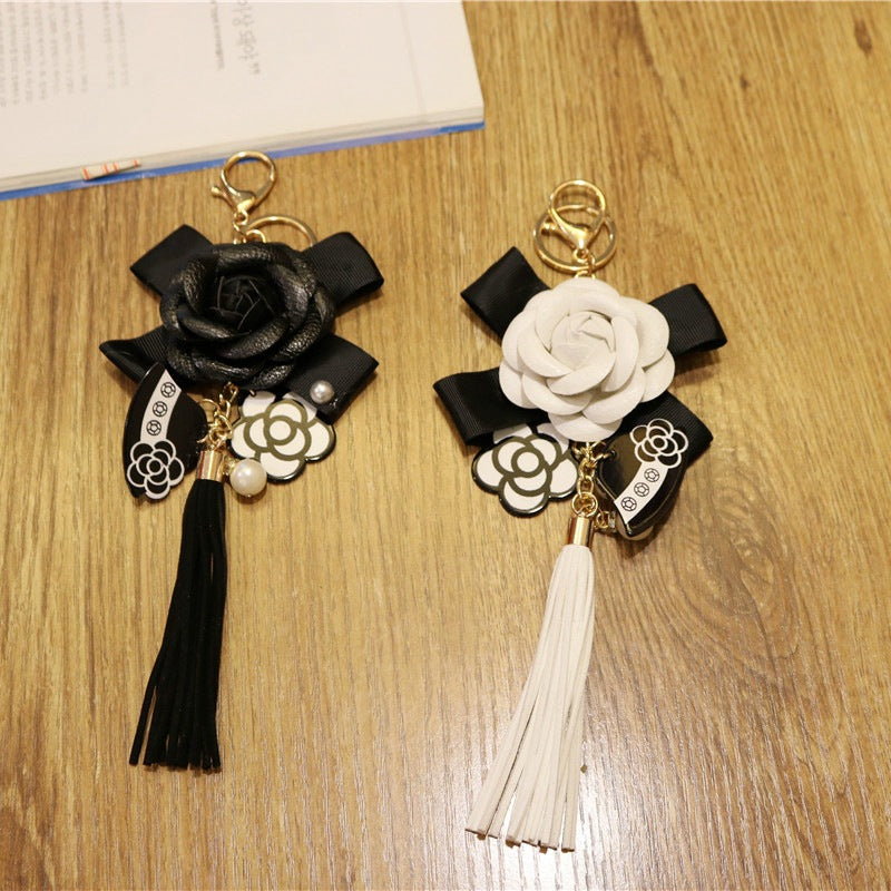Llavero de borla de cuero sintético estilo coreano, colgante para bolso con diseño de camelia