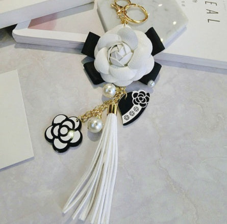 Llavero de borla de cuero sintético estilo coreano, colgante para bolso con diseño de camelia