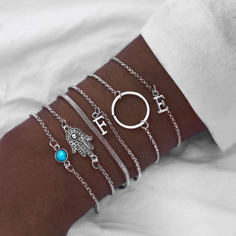 Combinación de Pulseras de Perlas Negras y Hojas de Loto (4 Piezas)