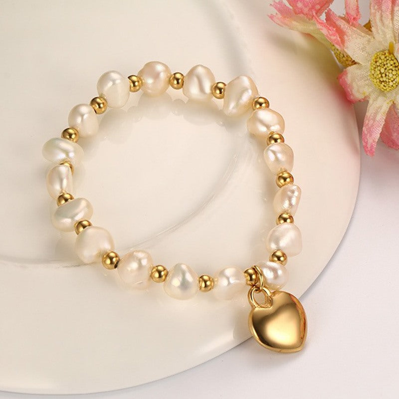 Pulsera hecha a mano de perlas de agua dulce con bolas de acero de titanio