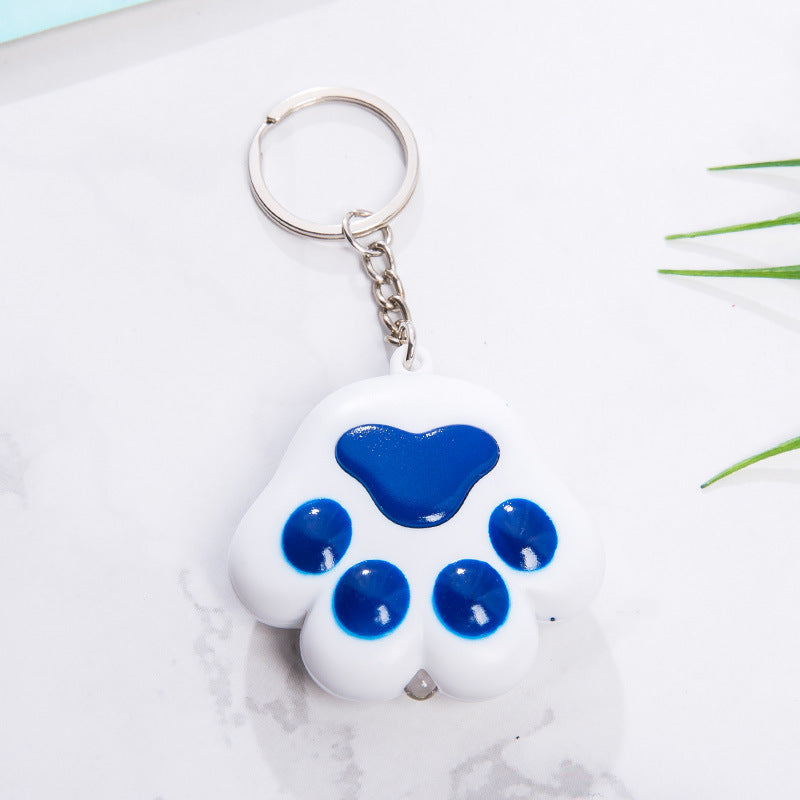 Llavero con diseño de pata de gato para otoño e invierno, con colgante de campana, luminoso, emite sonido, regalo creativo para funda de teléfono móvil, accesorios de interior de coche