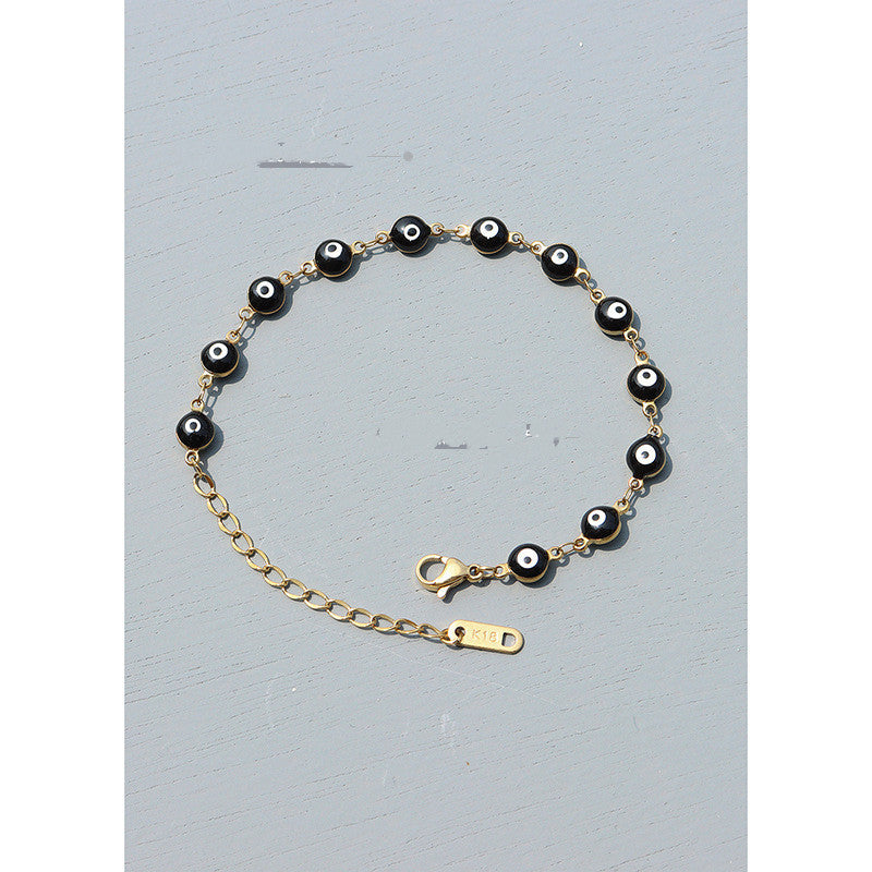 Armband aus Titanstahl für Damen mit schwarzen Öltropfen