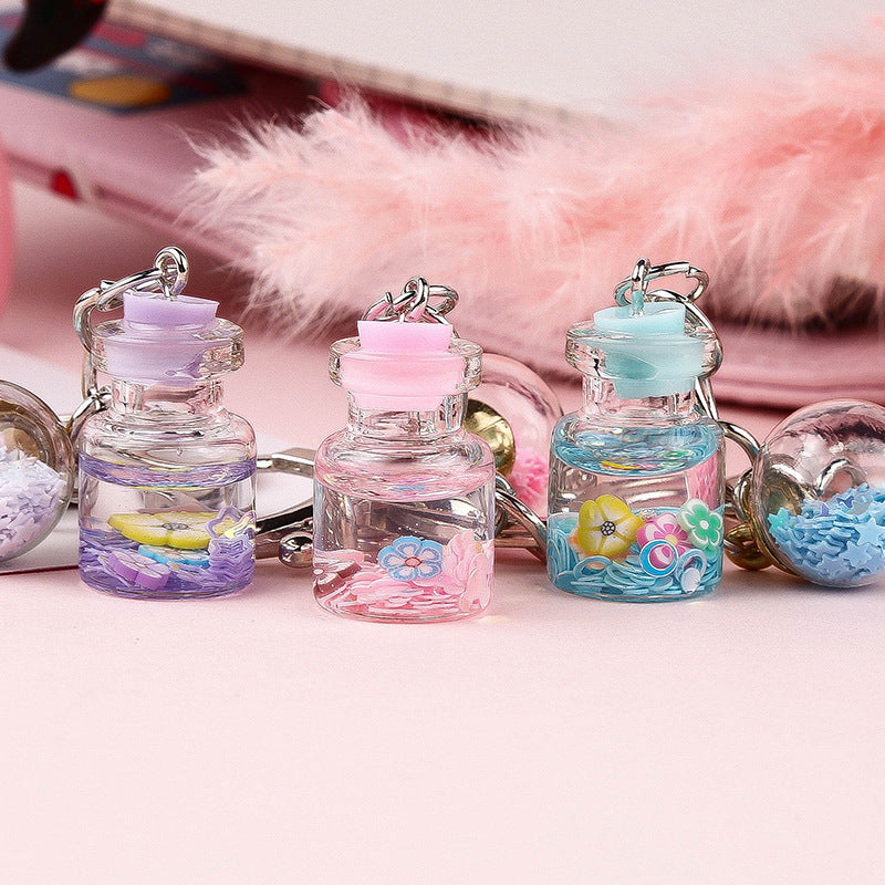Colgante de Llavero de Botella de Quicksand con Flor Lindo para Estudiante Femenina