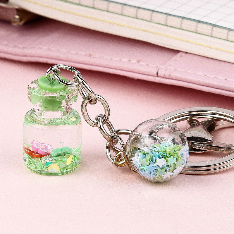 Colgante de Llavero de Botella de Quicksand con Flor Lindo para Estudiante Femenina