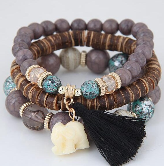 Brazalete de elefante bebé con borlas de cuentas de madera y varias capas