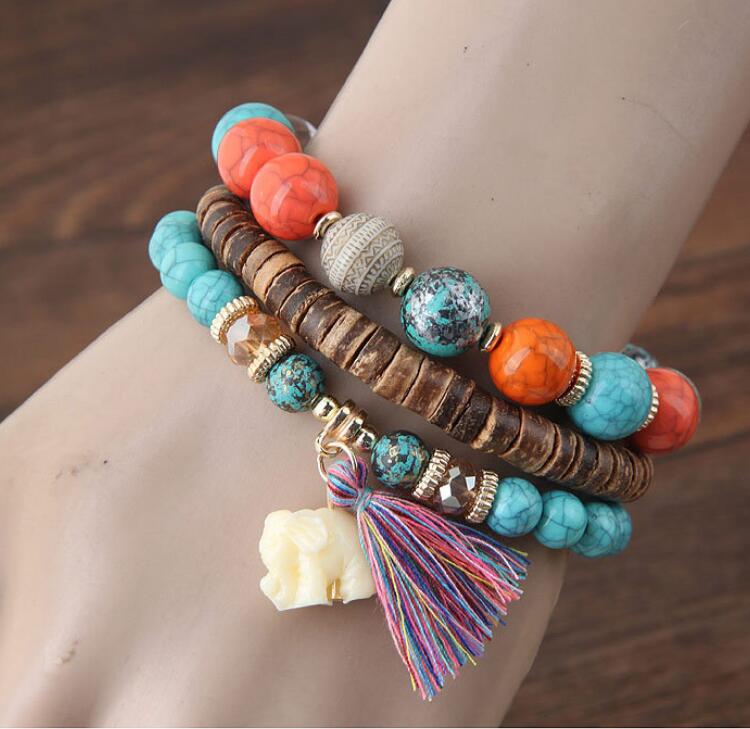 Brazalete de elefante bebé con borlas de cuentas de madera y varias capas
