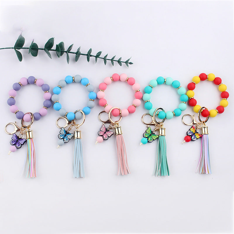 Llavero de pulsera de mariposa de dibujos animados hecho a mano con cuentas, creativo