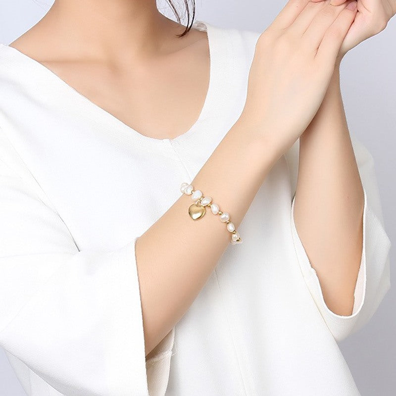 Pulsera hecha a mano de perlas de agua dulce con bolas de acero de titanio