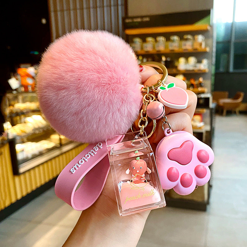 Bolsa de leche de durazno de cristal con botella de leche, llavero, colgante de bola de pelo.