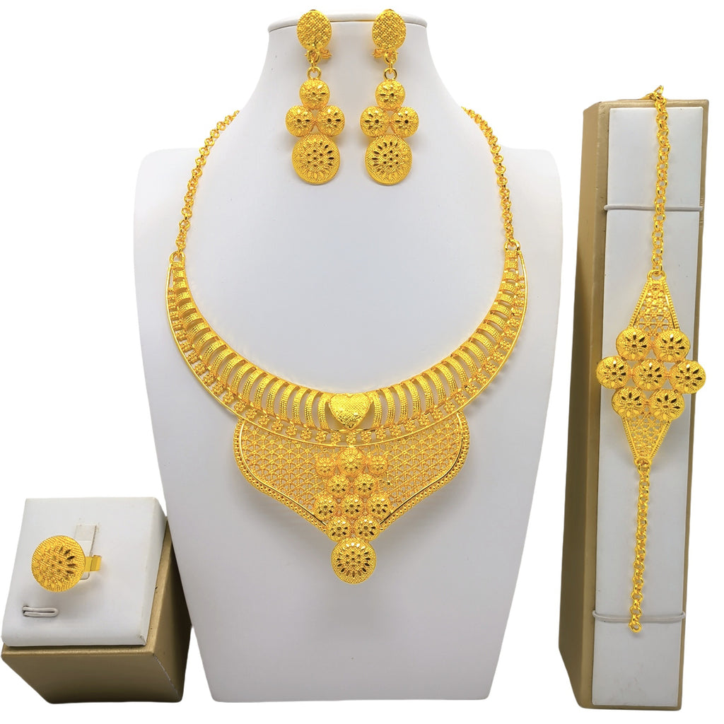 Juego de cuatro piezas de joyería de oro de 24 quilates: collar, pulsera, pendientes y anillo