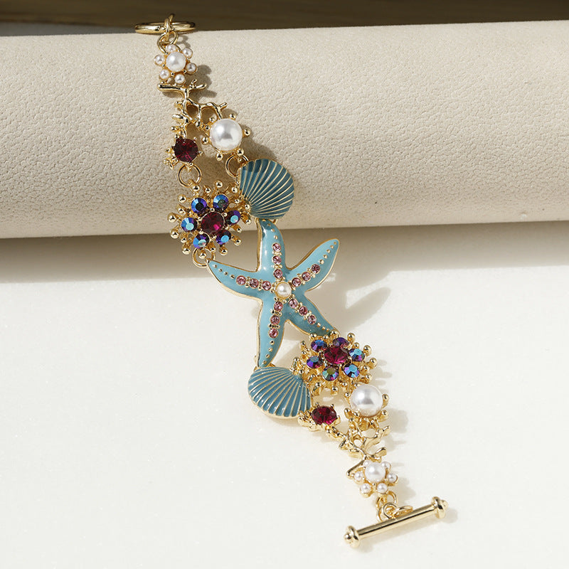 Pulsera de niña con diseño de estrellas de mar, concha y diamantes de imitación