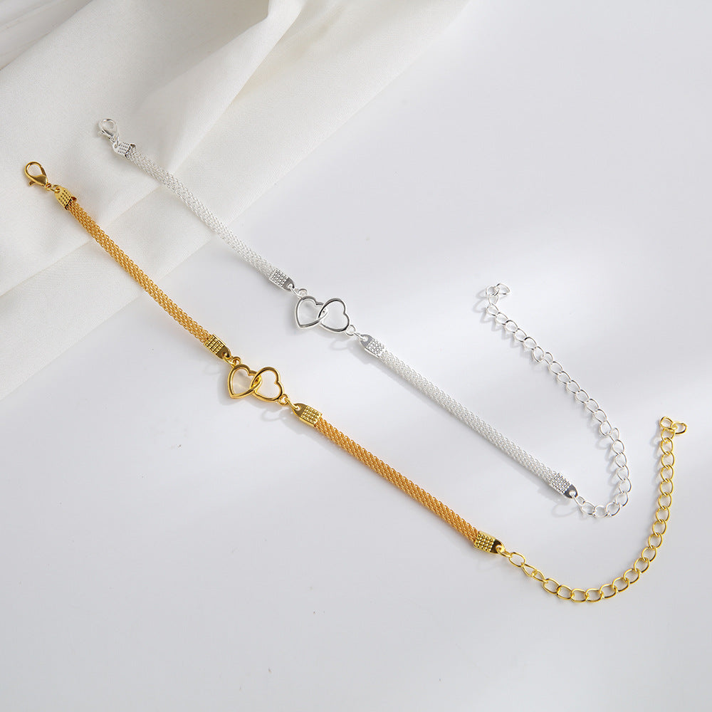 Tobillera de moda con cadena plana y dos corazones