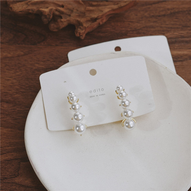 Pendientes con broche de Michel Lobe Wrap