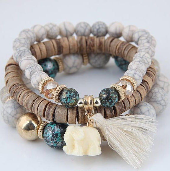 Brazalete de elefante bebé con borlas de cuentas de madera y varias capas