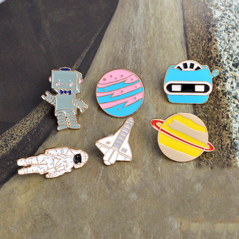 Broche de dibujos animados creativo de avión, astronauta, robot y planeta goteando