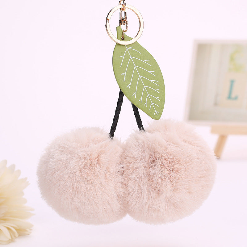 Llavero con colgante de hojas de cereza y pompón de fruta para bolso
