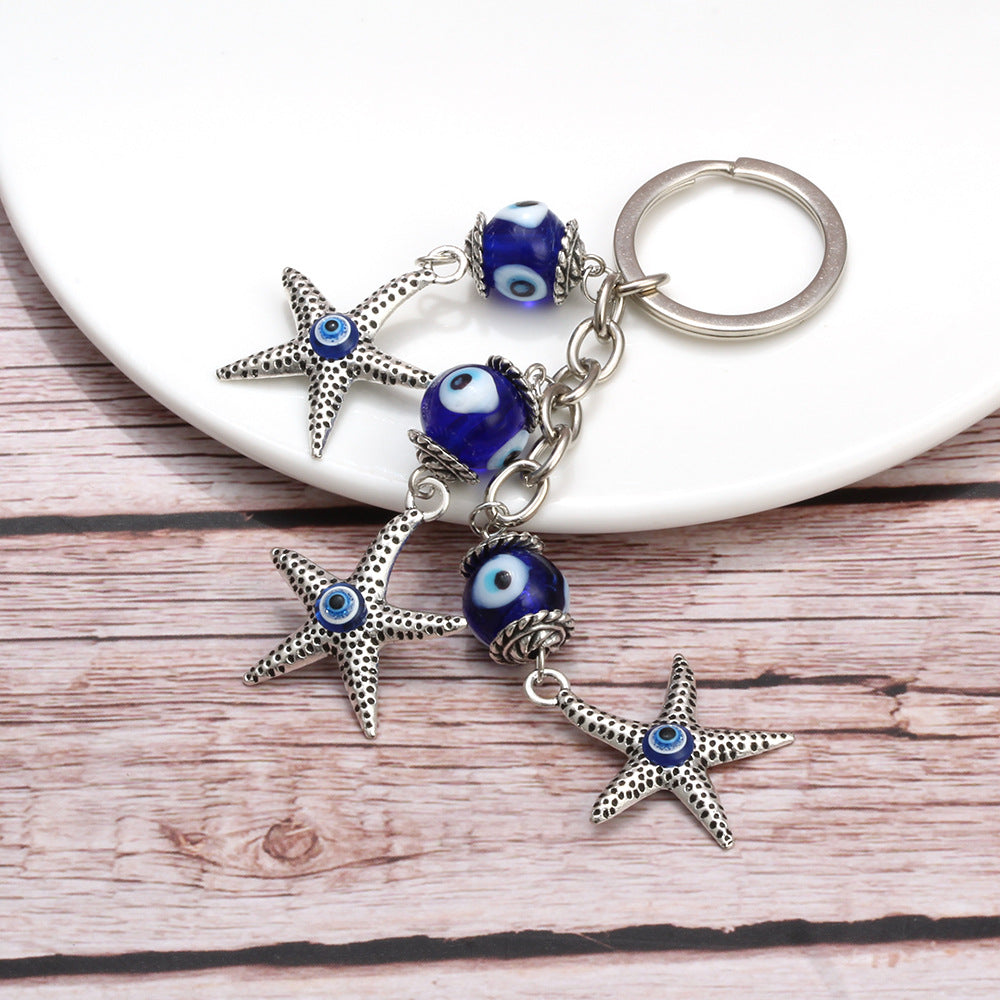 Llavero de estrella de mar, pavo, ojo azul