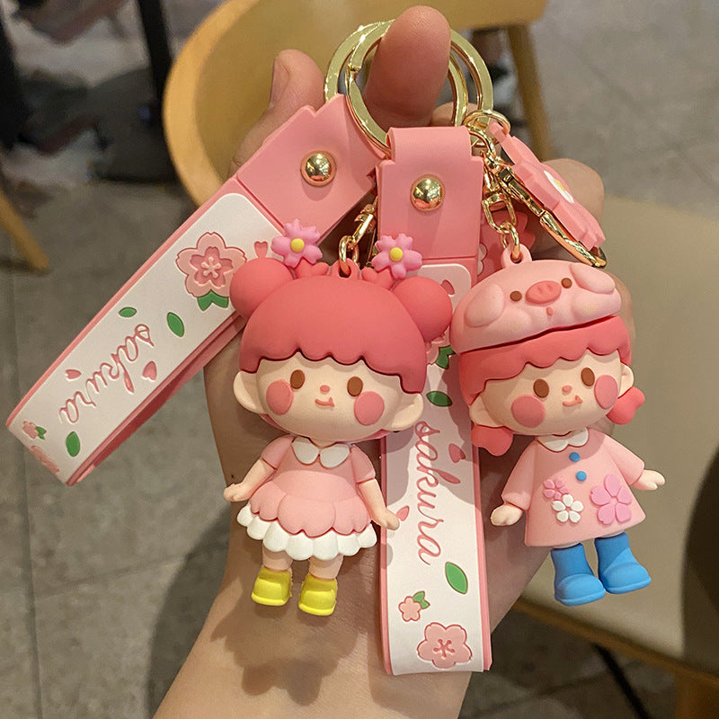 Nuevos Llaveros con Diseño de Muñeca de Niña con Flores de Cerezo