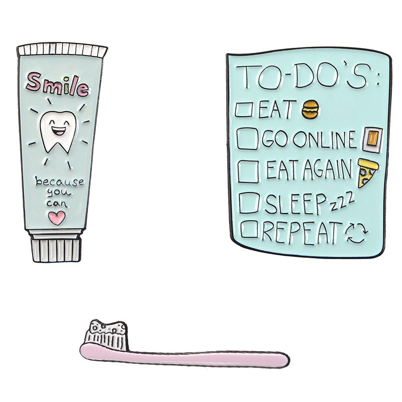 Lindo broche de pasta de dientes y cepillo de dientes de dibujos animados
