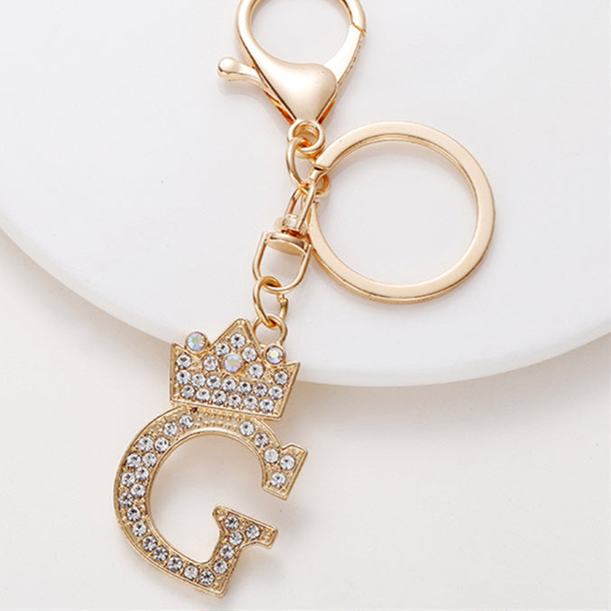 Llavero de metal con incrustaciones de diamantes y el alfabeto de la corona inglesa de 26 letras