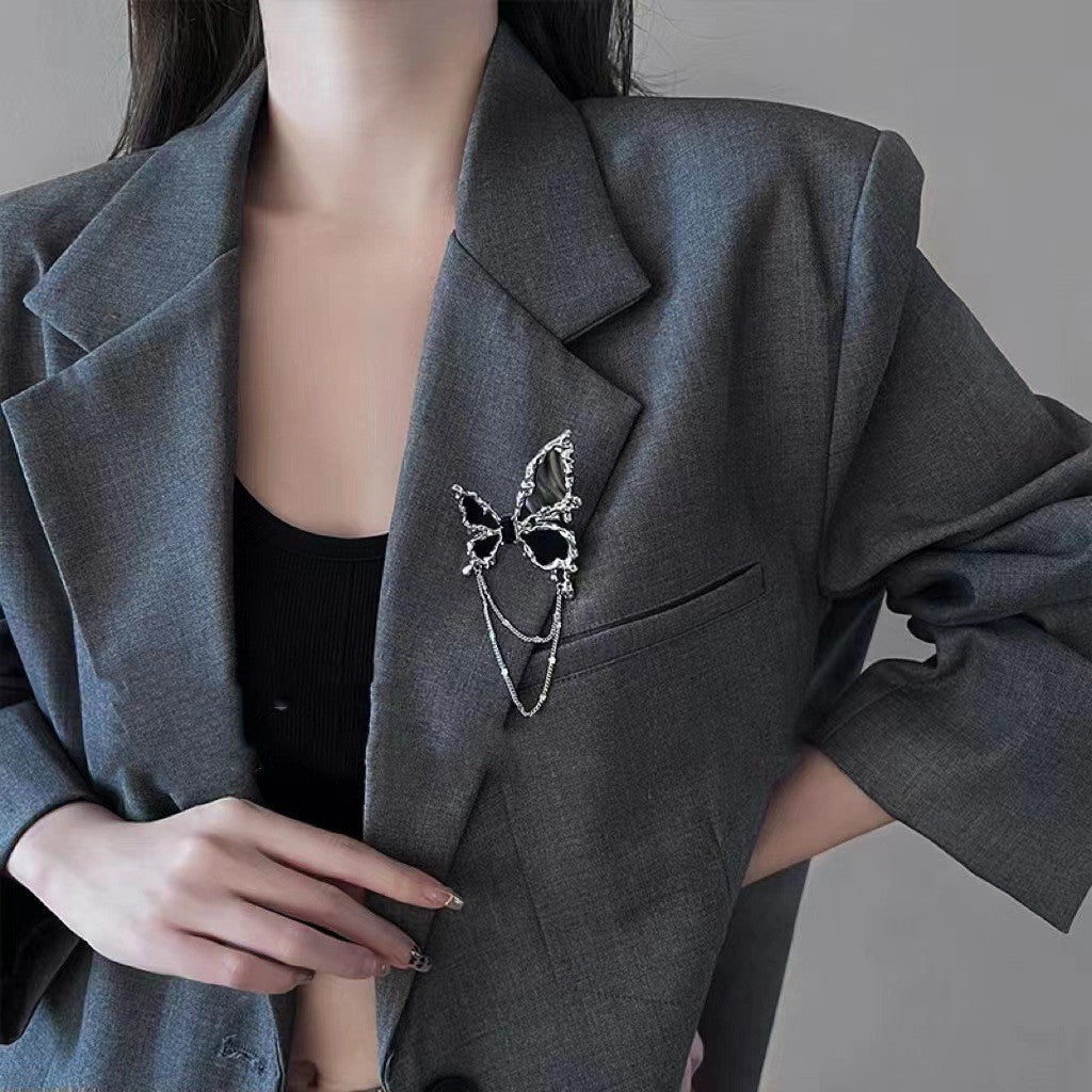 Broche con borlas de mariposa negro para mujer