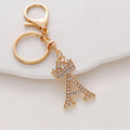Llavero de metal con incrustaciones de diamantes y el alfabeto de la corona inglesa de 26 letras