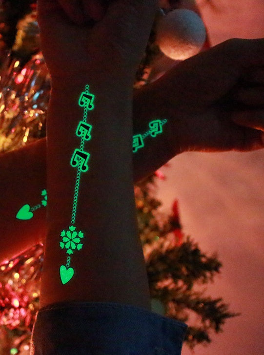 Tatuajes temporales fluorescentes que brillan en la oscuridad para Navidad