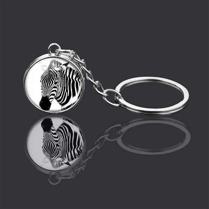 Adorno de llavero de bola de cristal de doble cara con animal