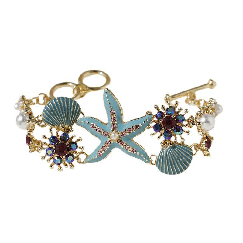 Pulsera de niña con diseño de estrellas de mar, concha y diamantes de imitación