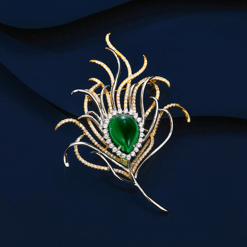 Broche de pluma de pavo real con circonita bicolor galvanizada esmeralda