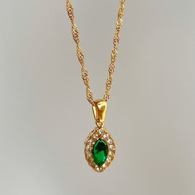 Collar de acero titanio con circonita ojo de caballo en forma de aceituna y perforación completa