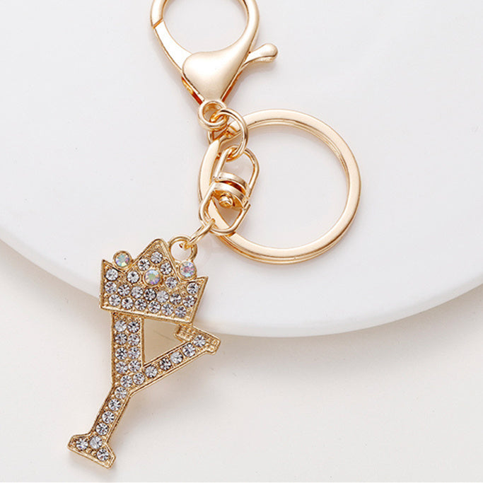 Llavero de metal con incrustaciones de diamantes y el alfabeto de la corona inglesa de 26 letras