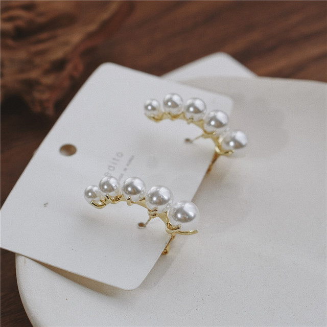 Pendientes con broche de Michel Lobe Wrap