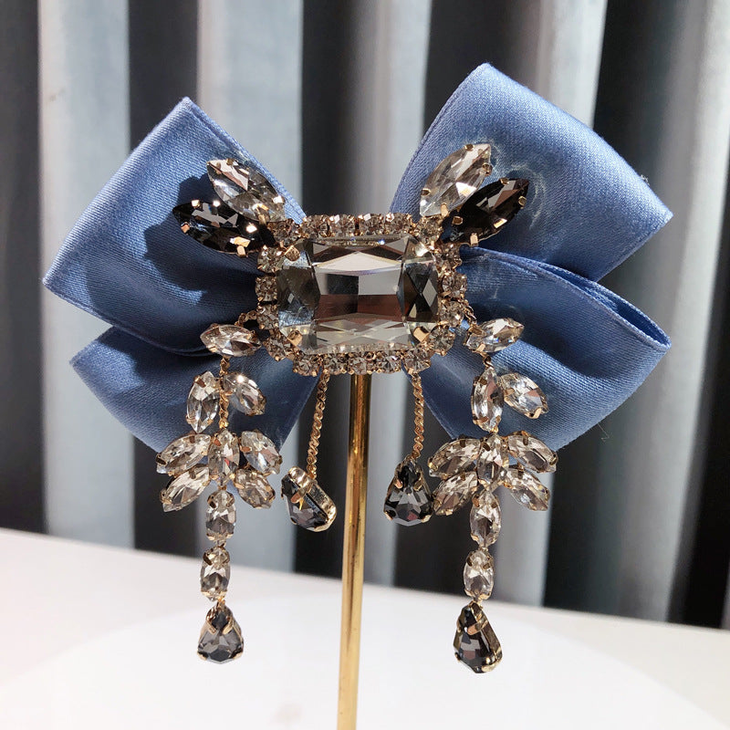 Broche de lazo británico vintage sólido de diamantes de imitación
