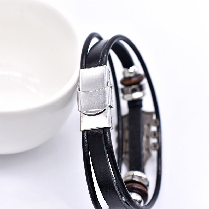 Europäische und amerikanische Zinklegierungs-Musikgitarren-Lederarmband